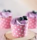 Blueberry cupcake on wooden stand